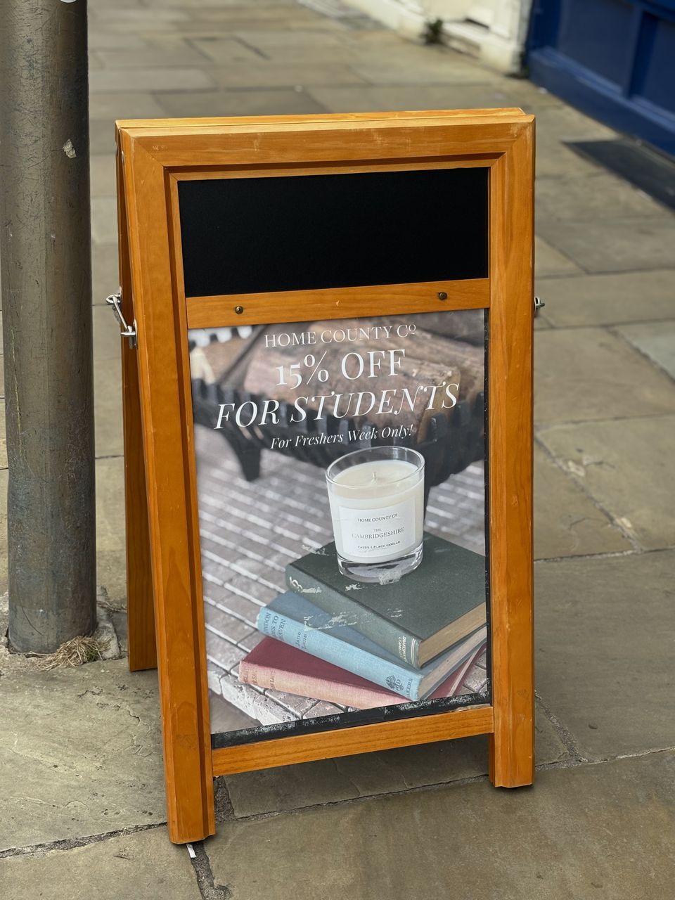 The A-frame board outside the shop with my Freshers' Week poster: 15 percent off for students